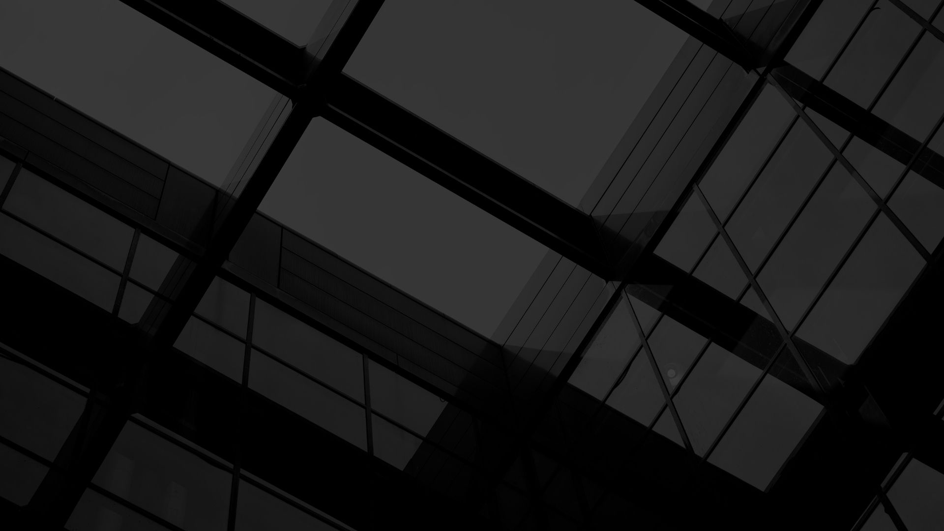 Looking up to the sky through modern building